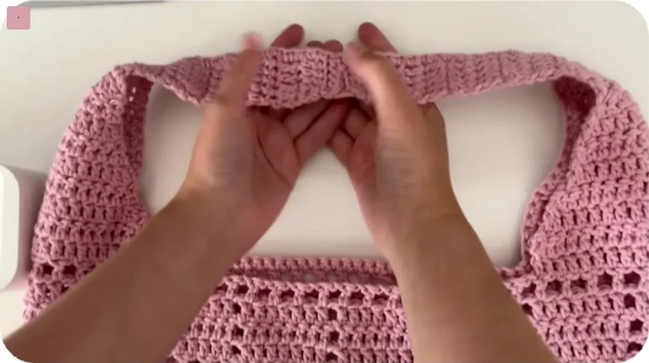 Two tapered crochet tote straps joined with five slip stitches